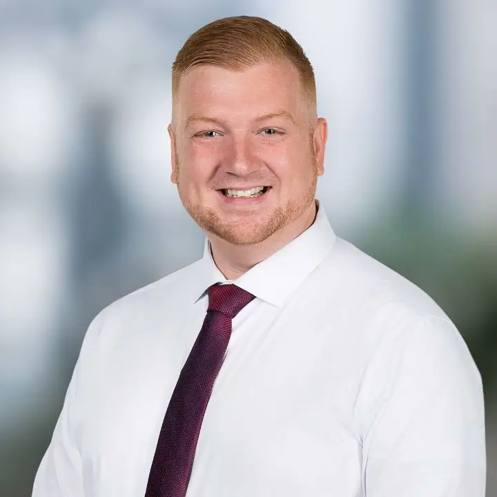 Justin Decker, Realtor with The Signature Group, in a professional headshot